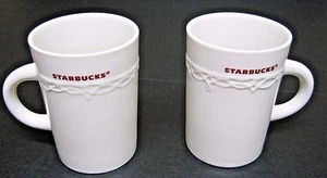 Starbucks Holiday Mugs Lot of 2, 1 Pair White Cups Red Writing Lacy Trim 10 oz - Picture 1 of 7