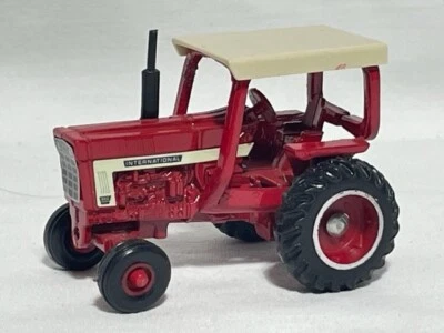 ERTL 1/64 International 966 w/ 4 post ROPS, White decal, Red Farm Toy Tractor - Image 1 of 2
