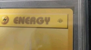 Pokemon 1st Edition Lightning Energy Shadowless TRUE GREY STAMP 100/102 PSA 9 - Bild 1 von 2