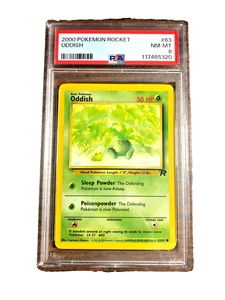 De colección Extraño Común #63 - PSA CASI NUEVO-COMO NUEVO 8 - 2000 Team Rocket Unlimited - Pokémon - Imagen 1 de 3