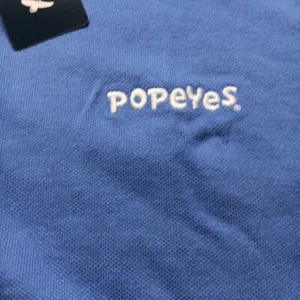 NWT New POPEYES CHICKEN blue Polo Shirt Adult 2XL - Picture 1 of 6