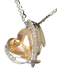 Fashion necklace with a Heart, a Yellow One on a Silver-Colored chain. - Picture 1 of 1