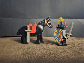 LEGO&reg; 6009 Black Knight is It features a knight minifigure, a horse, two swords.