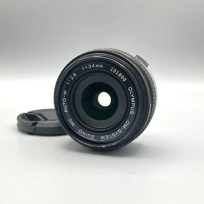 [EXC+5] Olympus OM SYSTEM ZUIKO MC AUTO W 24mm f/2.8 MF Wide Angle Lens - Image 1 of 4