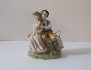 Couple on a Bench with a Dog Figurine - Picture 1 of 6