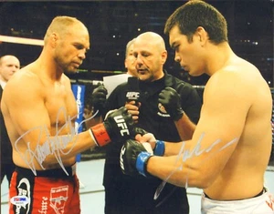 LYOTO MACHIDA RANDY COUTURE SIGNED AUTO'D 11X14 PHOTO PSA/DNA COA CHAMP UFC 129 - Picture 1 of 1