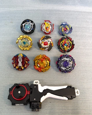 Beyblade Lote 9 con Lanzador Metal Fusion Burst Bakuten Shoot TAKARA TOMY Foto 1 de 4