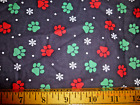 Red & Green Paw Prints with Snowflakes on black XMAS BTY Cotton Fabric