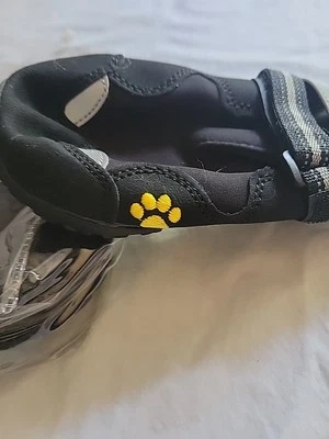 Zapatos para perros de exterior negros con estampados de patas amarillas y material cómodo tamaño Foto 1 de 3