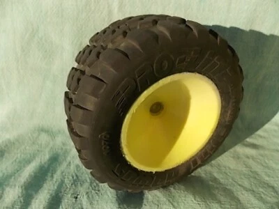 1 - VINTAGE PROLINE 1070 TRUCK TIRE & REAR WHEEL 4 Tall 2 3/8 inch ID - Image 1 of 4