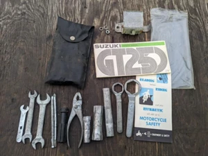 1975 SUZUKI GT250 HUSTLER VERY COMPLETE OEM TOOL KIT HOLDER W/ OWNERS MANUAL - Picture 1 of 11