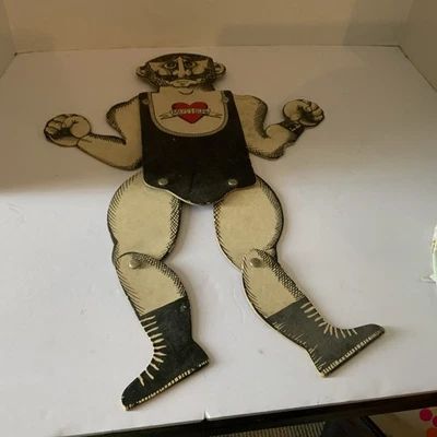 Colgante de pared vintage de hombre musculoso de cuerda de cómic de los años 40 Foto 1 de 4