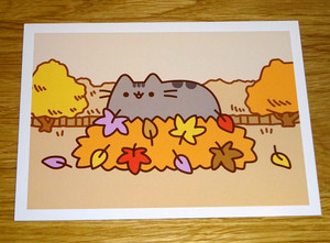 PUSHEEN CAT POSTCARD - PUSHEEN PLAYING IN THE AUTUMNAL LEAVES  - NEW