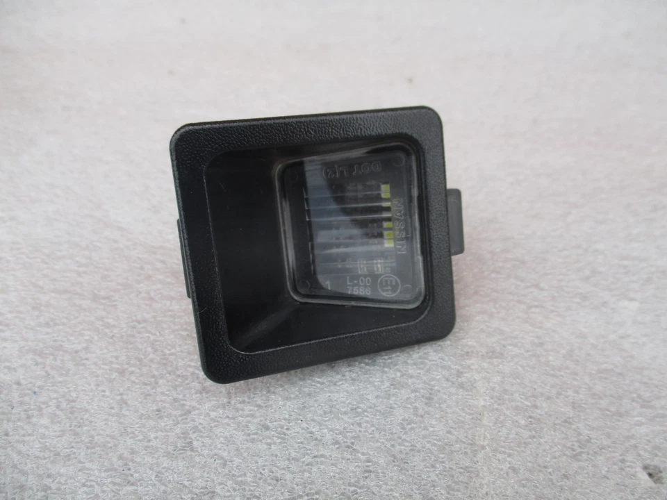 2022 - 2025 NISSAN FRONTIER LUZ MATRÍCULA TRASERA IZQUIERDA OEM LH Foto 1 de 4