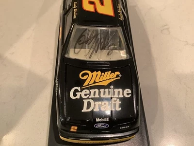 RUSTY WALLACE AUTOGRAPHED 1995 FORD MILLER GENUINE DRAFT DIECAST & CARD - Image 1 of 4