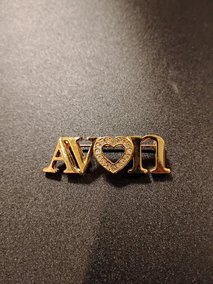 Avon Word Letters Crystal Rhinestone Heart Center Gold Tone Metal Pin Brooch - Image 1 of 1