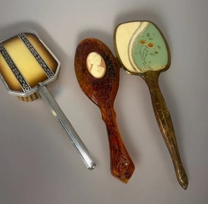 3 Antique/Vintage Hair Brushes. Silver Black Designs, Avon Cameo, Brass Flower - Picture 1 of 10
