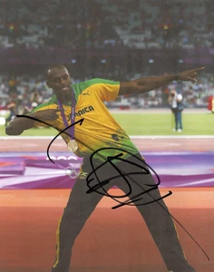 ATHLETICS: USAIN BOLT SIGNED 10x8 LONDON 2012 CELEBRATION PHOTO+COA **JAMAICA** - Picture 1 of 1