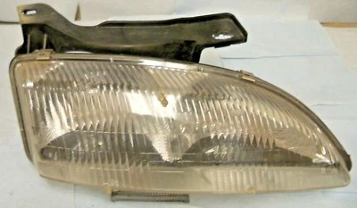 CHEVROLET CAVALIER 1995-1997 MONTAJE FARO LADO PASAJERO Y SOPORTE.CEREZA  Foto 1 de 4