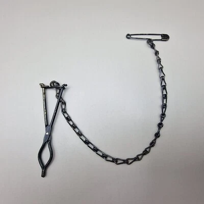 Antique Victorian Painted Black Skirt Lifter Chatelaine Clip with Safety Chain - Image 1 of 4