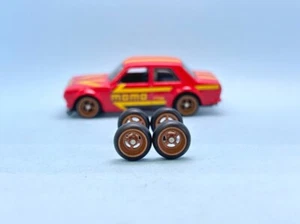 R476 Hotwheels 1/64 Real riders # Donut 4 Spoke Bronze 10mm Long Rubber Wheels - Picture 1 of 4