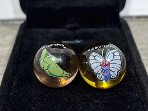 Vintage ToyBiz Pokemon Marble #11 Metapod & #12 Butterfree Clear Marbles - Bild 1 von 5