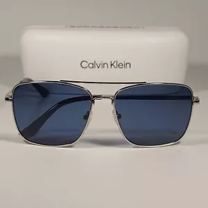 Gafas de sol Calvin Klein Navigator CK19136S 045 marco plateado lente azul 57 mm - Imagen 1 de 11