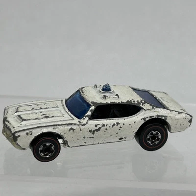 Oldsmobile 442 State Police Cruiser 1969 vintage Hot Wheels Redline luz azul Foto 1 de 4