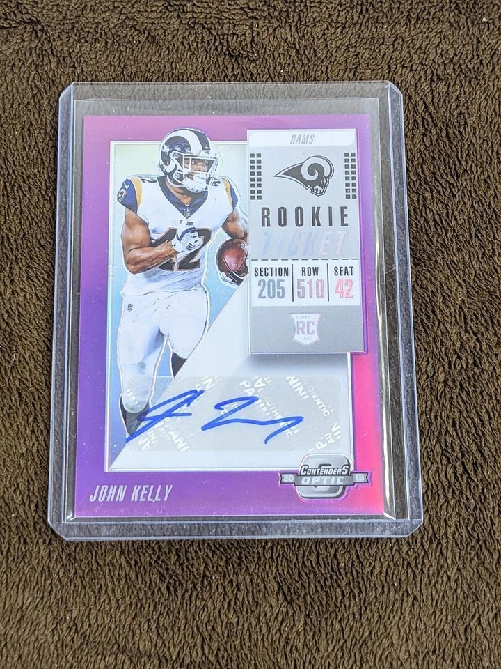 2018 CONTENDERS OPTIC ROOKIE TICKET PURPLE /99 AUTO JOHN KELLY RAMS - Image 1 of 1
