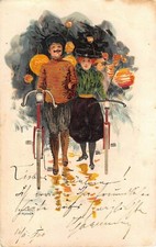 1900 sgd. Kirchner Man & Woman Cyclists with Bicycles & Japanese Lamps post card
