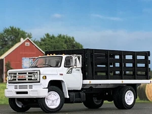 1/64 DCP WHITE/BLACK GMC 6500 SINGLE AXLE STAKE BED - Picture 1 of 5