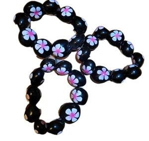 3 Kukui Nuss Stretch Armband Blumen rosa schwarz Hawaii Floral elastisch klobig - Bild 1 von 6