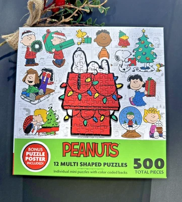 Peanuts Snoopy Holiday  500pc color coded Puzzles- 12 multi shaped puzzles - Image 1 of 4
