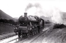 C. 1920s POSTCARD: EXPRESS LOCO AT TEBAY, CUMBRIA