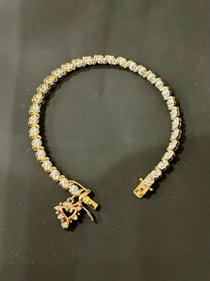 Pulsera de tenis con detalles de diamantes y rubíes Foto 1 de 4