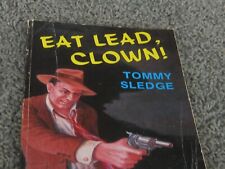 EAT LEAD, CLOWN! Satire detective novel by Tommy Sledge. 1st ed. 1987. INSCRIBED