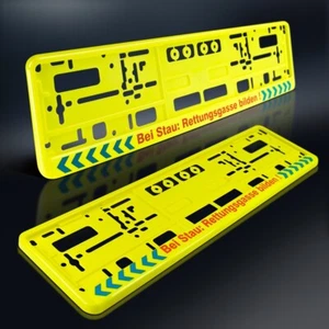 2 Kennzeichenhalter | BEI STAU: RETTUNGSGASSE BILDEN | NEON GELB | DHL-Versand - Bild 1 von 6