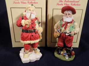 LOT OF 2 INTERNATIONAL SANTA CLAUSE COLLECTION FIGURINES - UNITED STATES BRAZIL - Picture 1 of 5