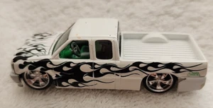 Muscle Machines Truckin Ford F-150 Lowrider White with Black Flames 1:64 - Picture 1 of 7