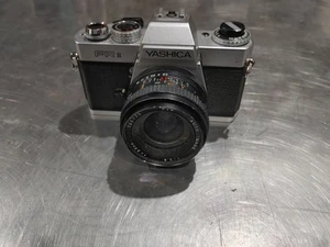 Cámara vintage Yashica FR II con lente de 28 mm negra/plateada sin probar buen estado - Imagen 1 de 7
