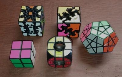 Lot Of 5 Mixed Puzzles Rubiks, Mefferts Challenge Gear Cube - Image 1 of 2