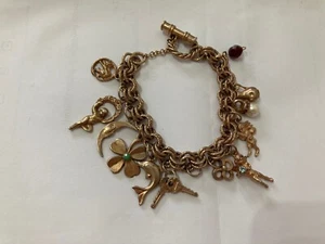 BRACCIALE DONNA VINTAGE IN METALLO DORATO CON NINNOLI ANGELO FIORI PUTTI PIETRE. - Foto 1 di 13