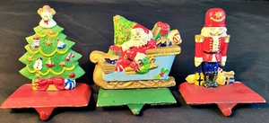 3 Medias de Navidad de hierro fundido vintage de IMPORTACIONES DEL MEDIO OESTE CAÑONES - Imagen 1 de 9