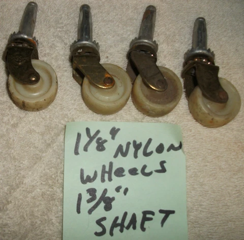 Four nylon Furniture Wheel Casters Vintage wheels.1-1/8" wheels 1-3/8" shaft Cover