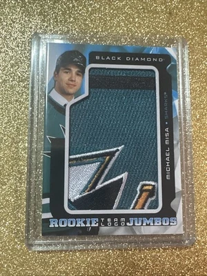 2025-26 UD Black Diamond Michael Misa Rookie Team Logo Jumbo Patch RC Sp - Image 1 of 4