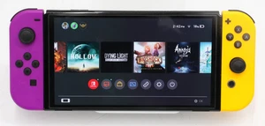 Nintendo Switch OLED Video Game Console HEG-001 with Purple & Orange Joy-Cons - Picture 1 of 12