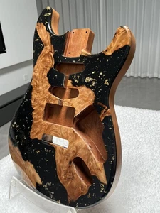 mahogany electric guitar has a black body with a resinous luster - Picture 1 of 13