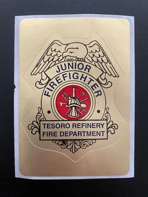 Tesoro Refinery Fire Department Junior Firefighter Gold Sticker Badge - Image 1 of 2