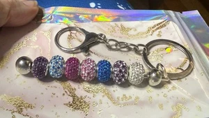 Pink, Blue, Purple, & Clear charmed memories charms on Silver keychain - Picture 1 of 2