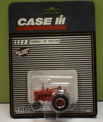 Vintage ERTL 1/64 Scale Farmall M Tractor on gray striped card - Image 1 of 4